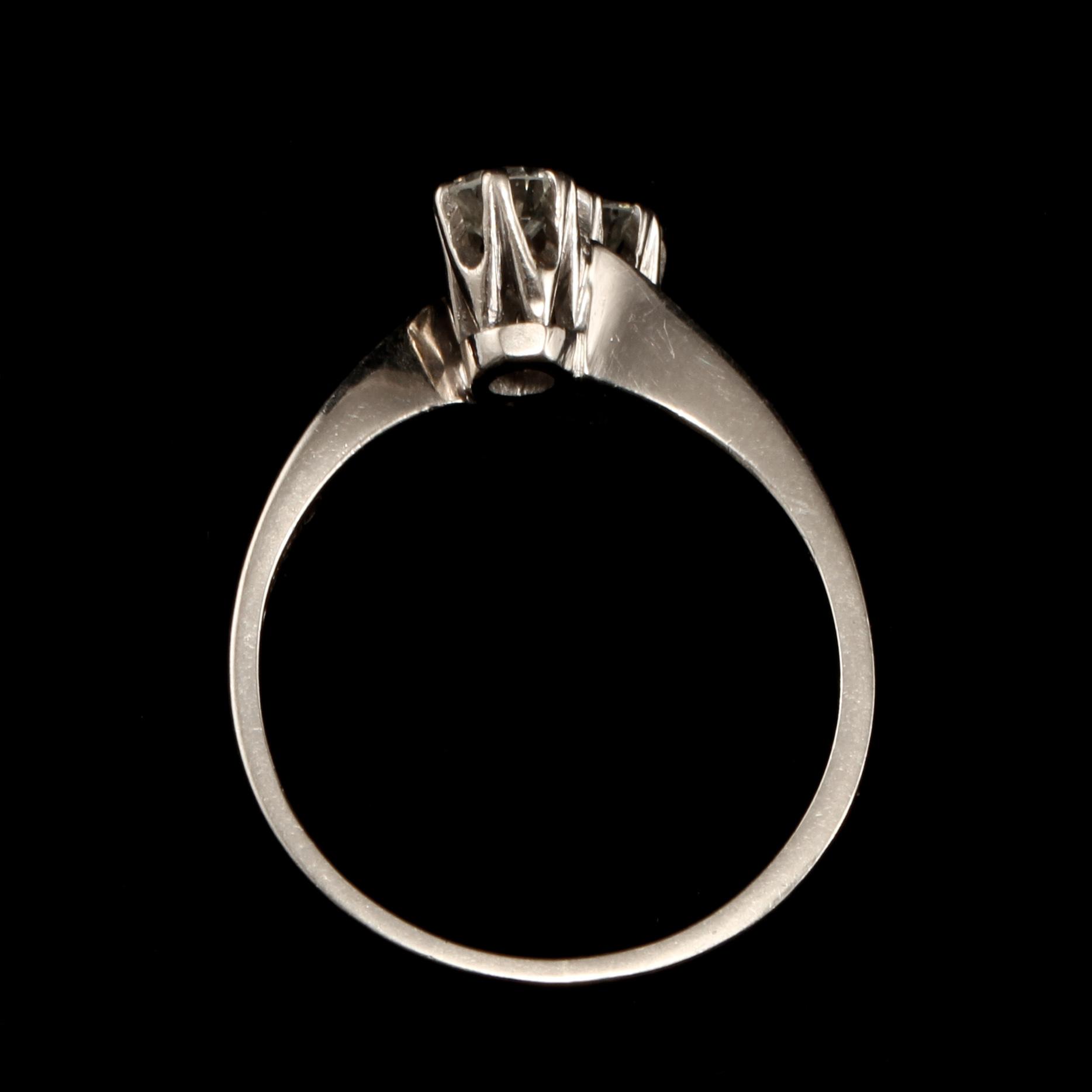 RING, 18k vitguld med 2 briljantslipade diamanter, tot 0.45 ct, Bo Cedstam, Stockholm, 1972. Vikt 3 g.