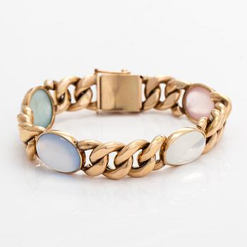 A 14K gold bracelet with cabochon-cut stones.