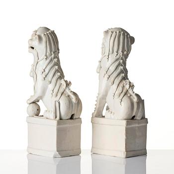 A pair of Chinese blanc de Chine 'Buddhist lion' joss stick holders, Qing dynasty, Kangxi (1662-1722).