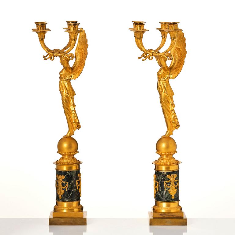 A pair of French Empire four-light candelabra, attributed to Francois Rabiat (bronze maker in Paris 1756-1815).