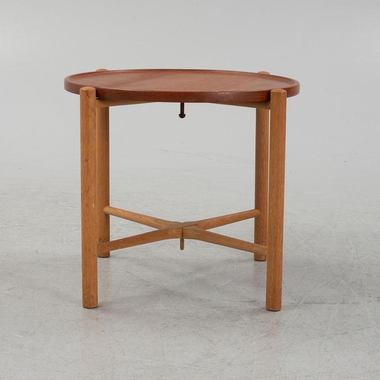 Hans J. Wegner, a model PP35 teak and oak tray table, Andreas Tuck, Denmark, mid 20th Century.