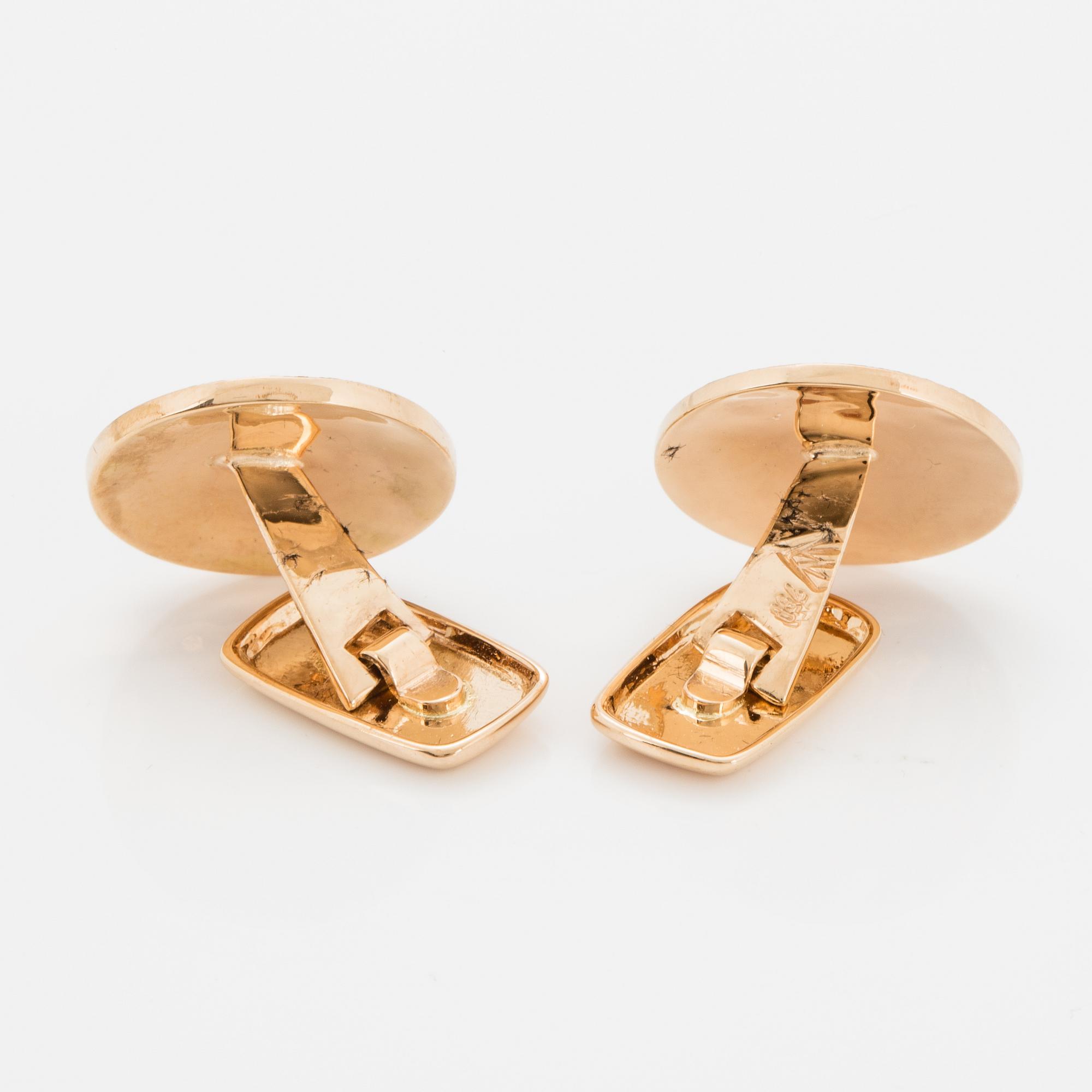 18K gold and black diamond cufflinks.