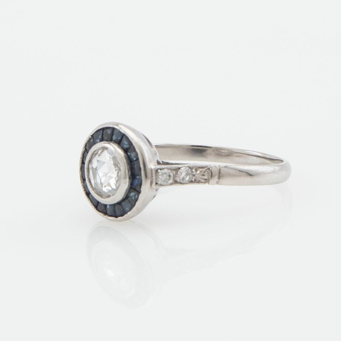 Halo ring, platinum with rose-cut diamond and sapphires.