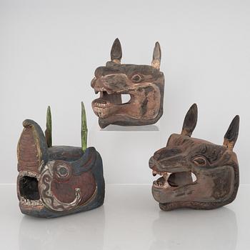 Four Tibetan/South East Asian wooden decorations, 20th century.