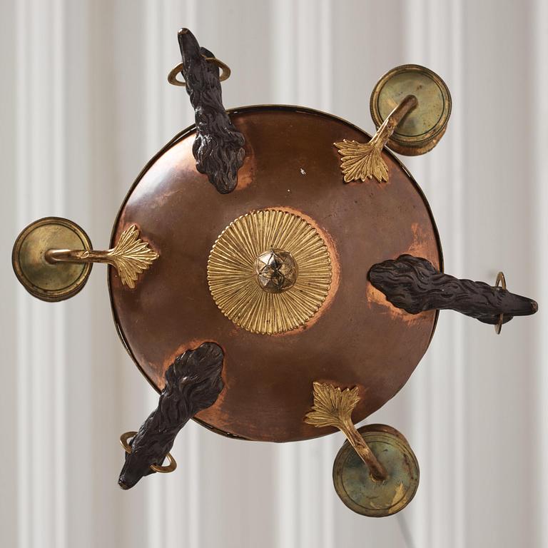 A Swedish patinated bronze and copper three-light chandelier, early 19th century.