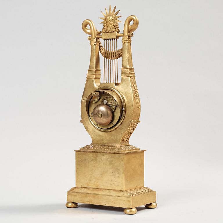 A French Empire early 19th century gilt bronze mantel clock.