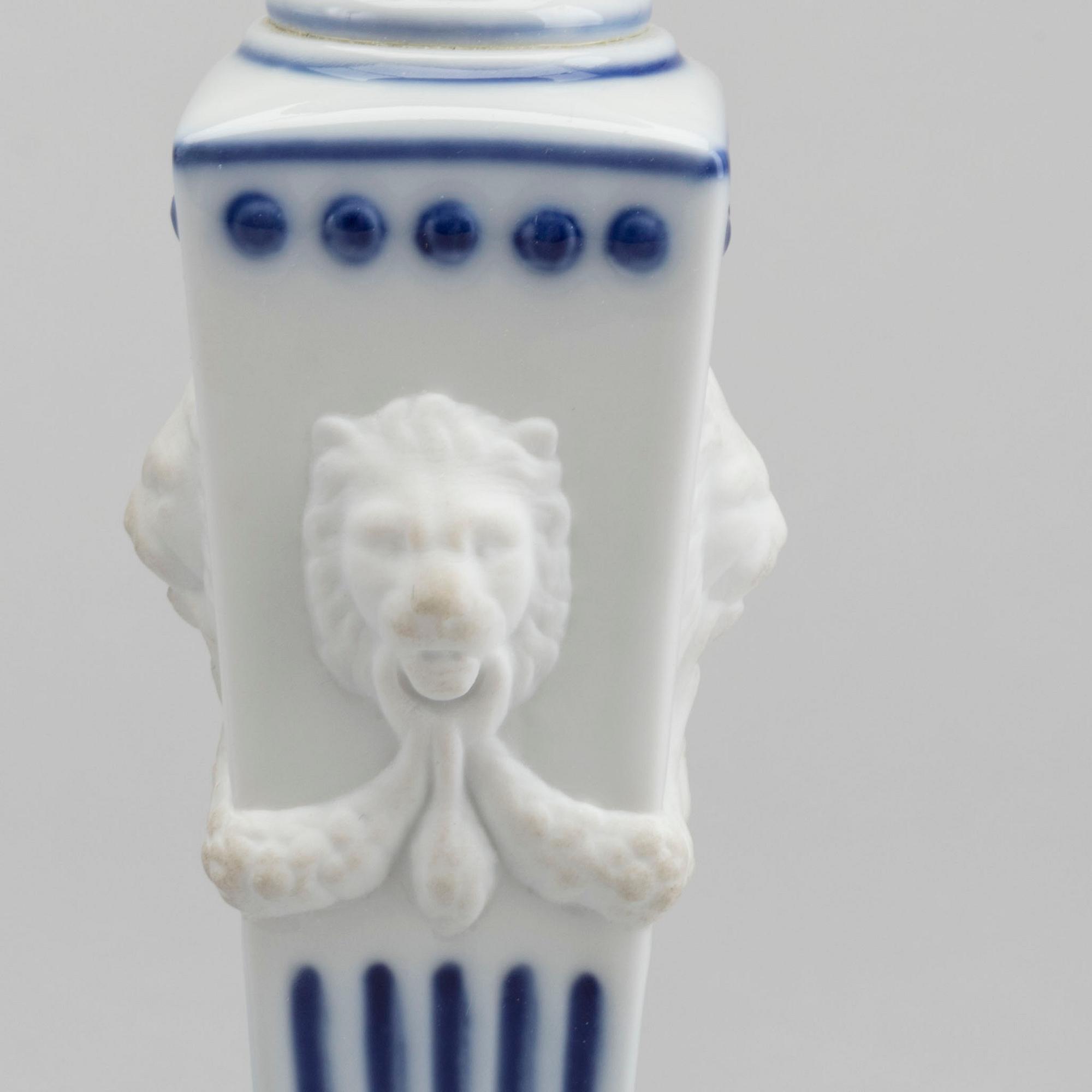 A PAIR OF ROYAL COPENHAGEN PORCELAIN CANDLE STICKS.