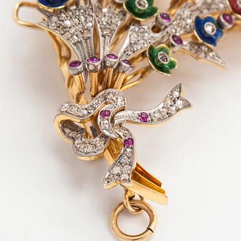 A 17K gold brooch/pendant with rose-cut diamonds, cabochon-cut rubies and enamel.