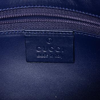 Gucci, a blue leather and fabric bag.