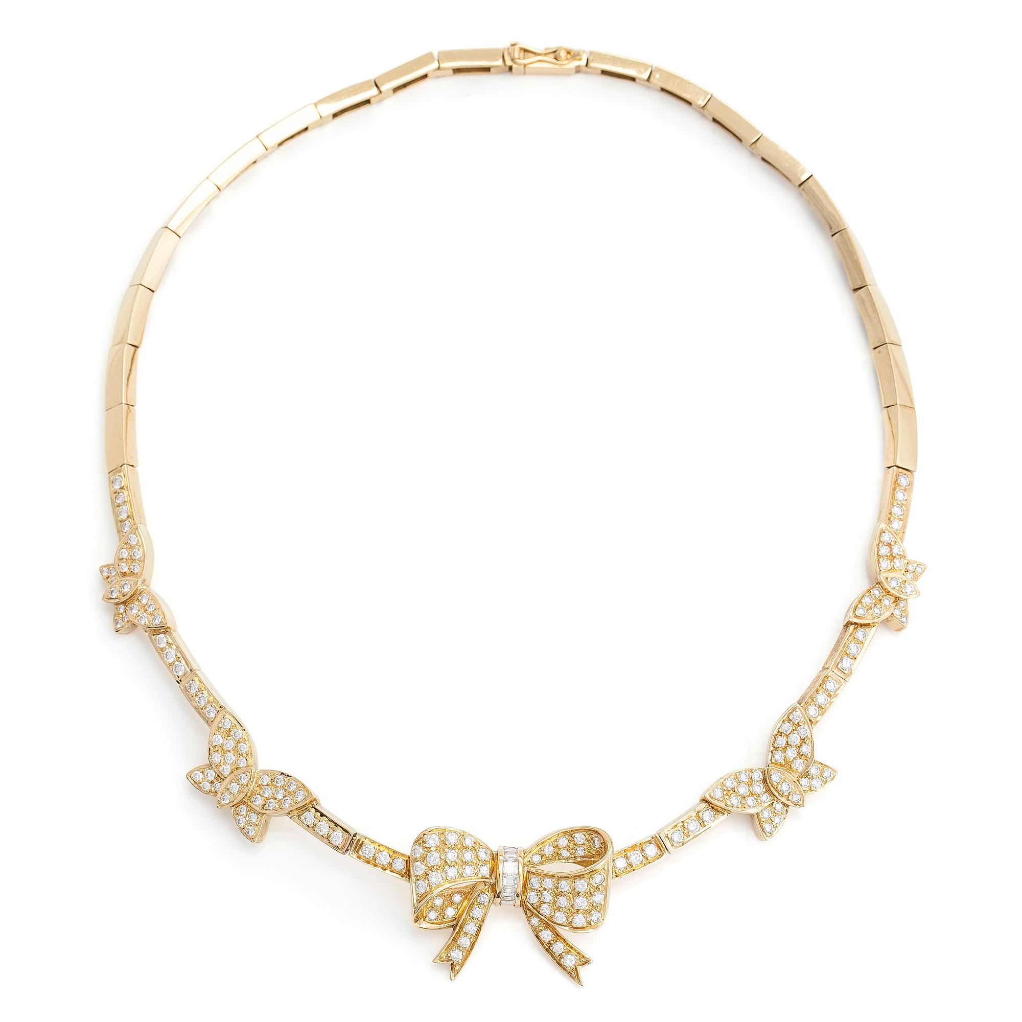 An 18K gold necklace, with brilliant- and baguette-cut diamonds totaling approx. 4.44 ct.