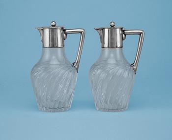 A PAIR OF WINE PITCHERS, 833 silver, glass. Germany c. 1900. Height 19 cm.