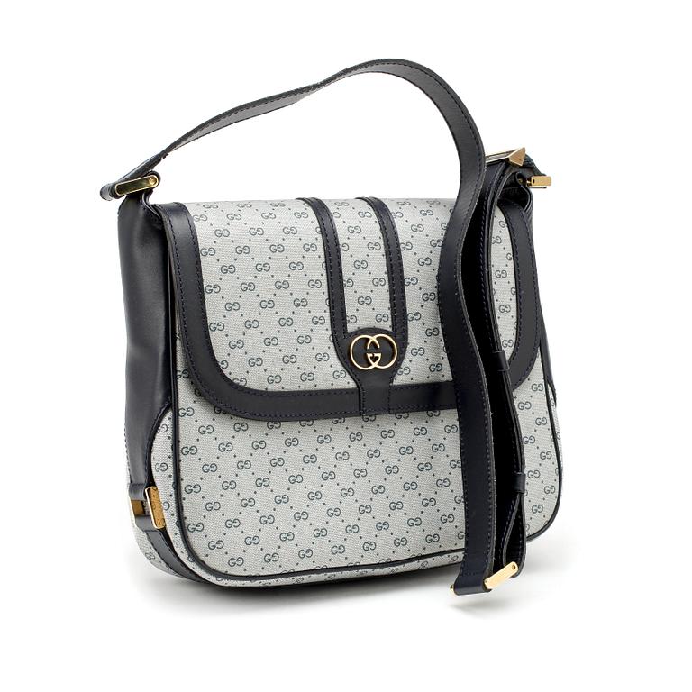 GUCCI, a coated blue monogram canvas shoulder bag.