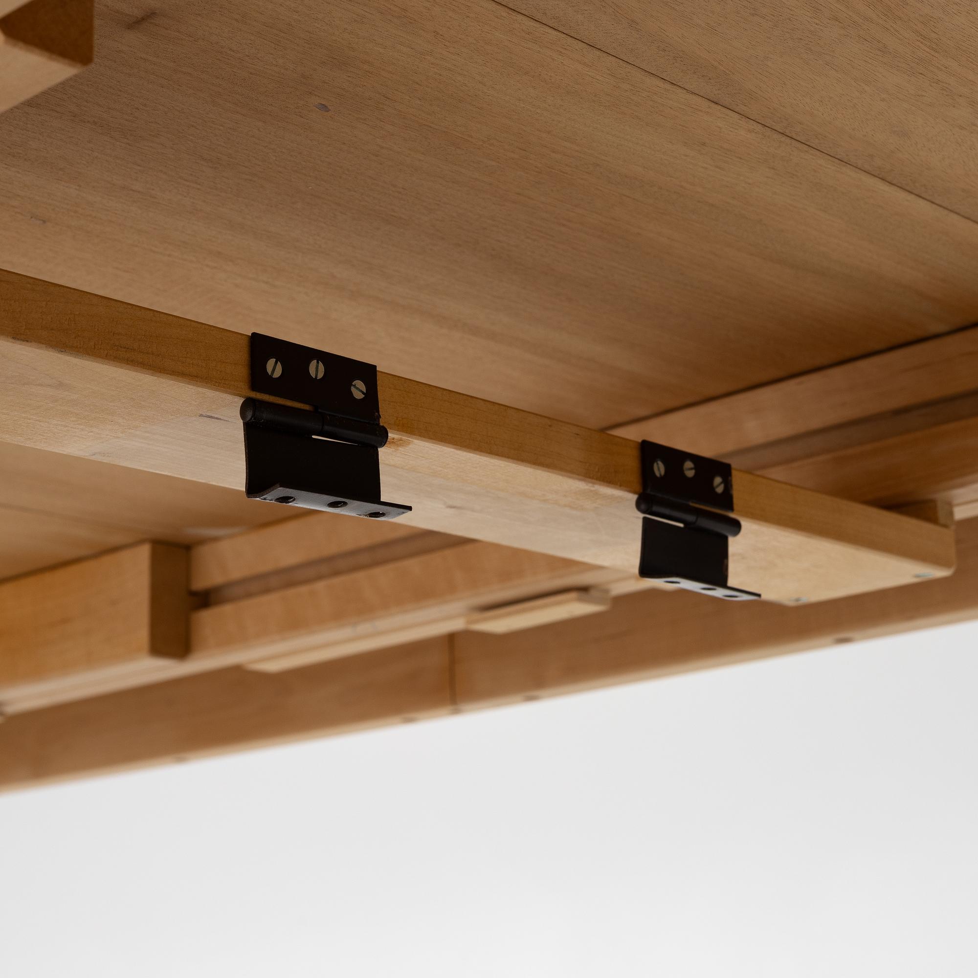 Carl Malmsten, a dining table with eight chairs, 'Camlare Nyckel', Sweden, second half of the 20th century.