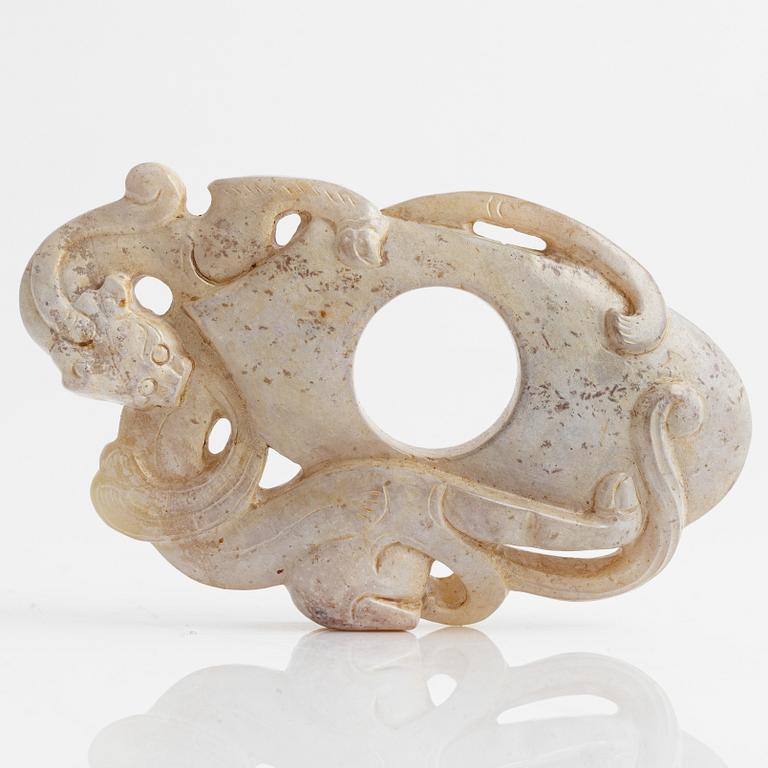An archaistically carved nephrite sculpture, China, 20th Century.