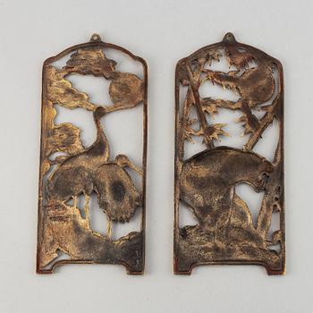 Two Chinese bronze wall reliefs, 20th century.