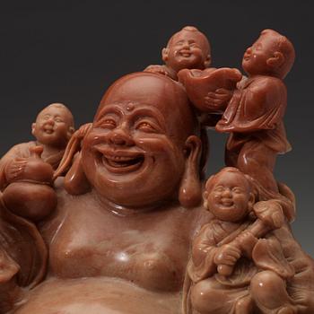 A soapstone group of Bodai with attendants, late Qing dynasty (1644-1912).