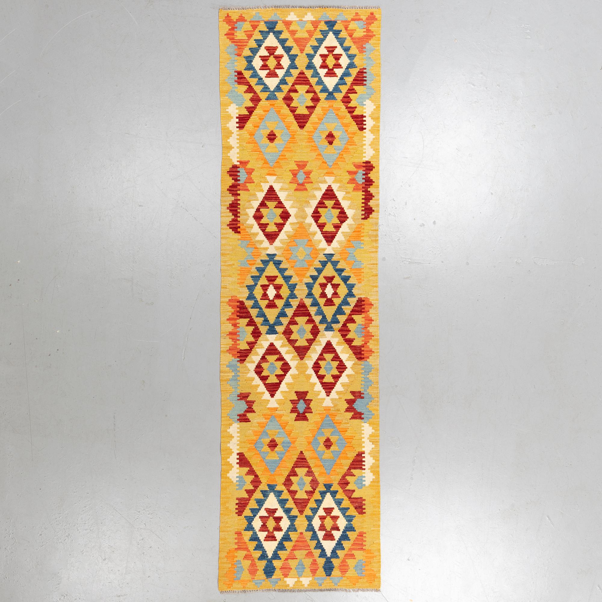 A runner, kilim 302 x 82 cm.