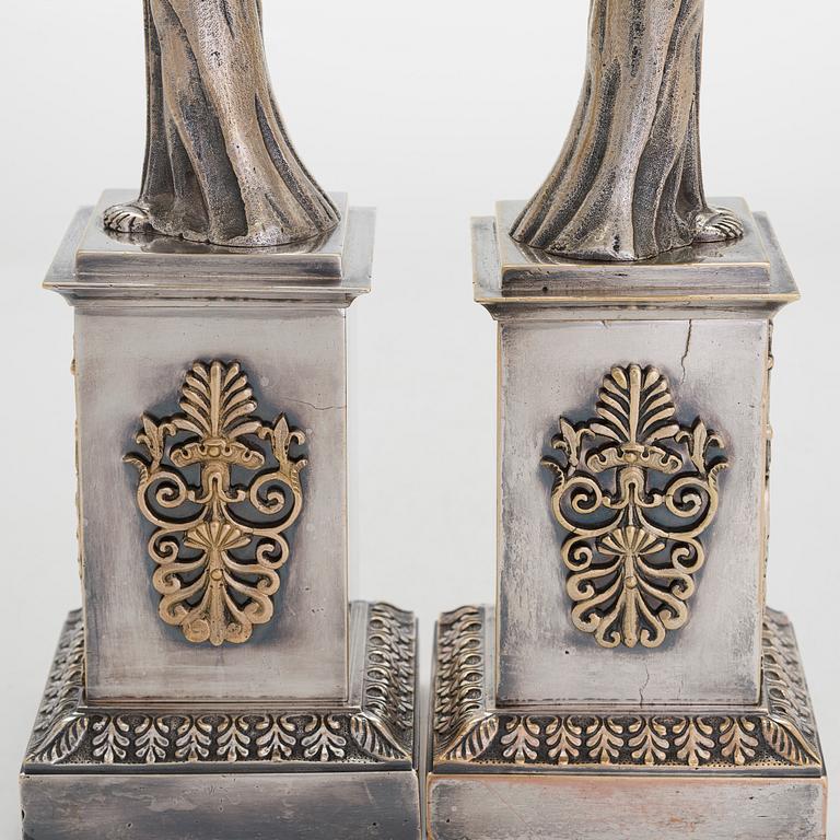 A pair of Empire silver plated bronze candelabra, first half of the 19th century.