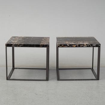 A pair of marble coffee tables from Maxalto, Italy.