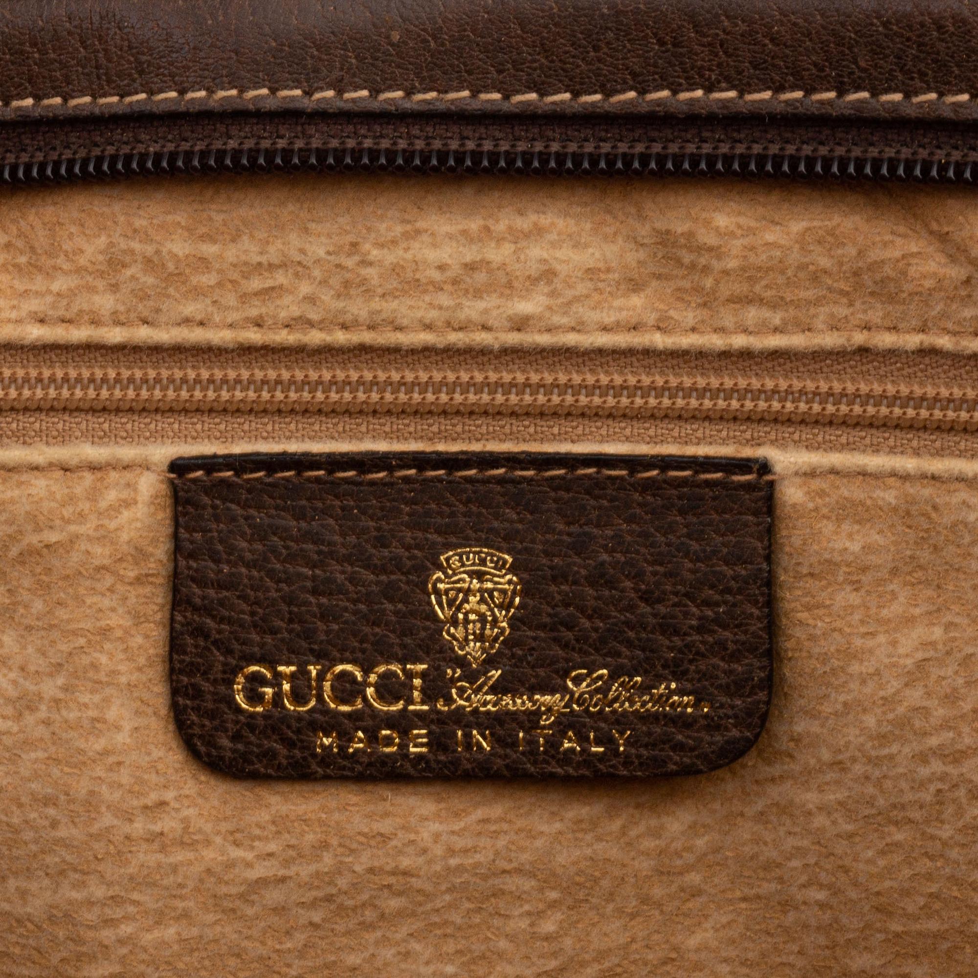 Gucci, a canvas handbag.