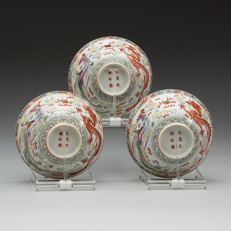 A set of three famille rose bowls with covers, Qing dynasty with Guangxu six character marks and period (1874-1908).