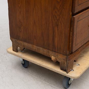 An oak secretaire, first half of the 19th century.