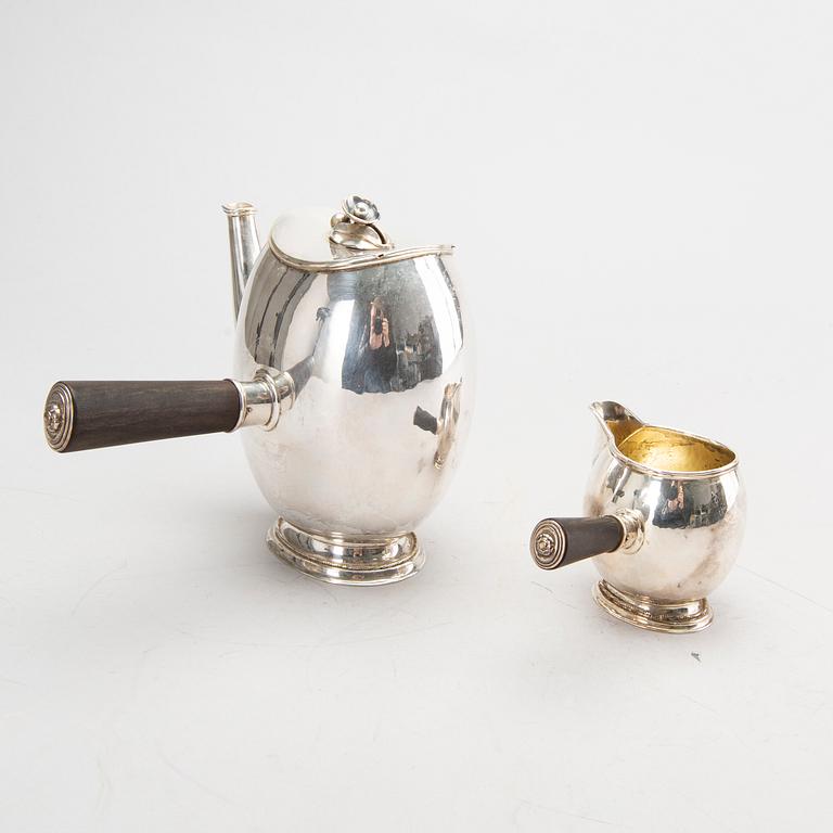 A Swedish 20th century silver coffee pot and creamer, mark of GAB Stockholm 1946 and 1948.