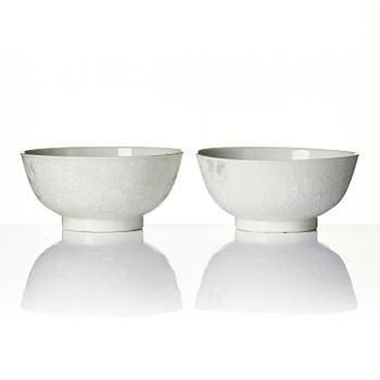 A pair of white glazed lotus bowls, Qing dynasty, 18th century.