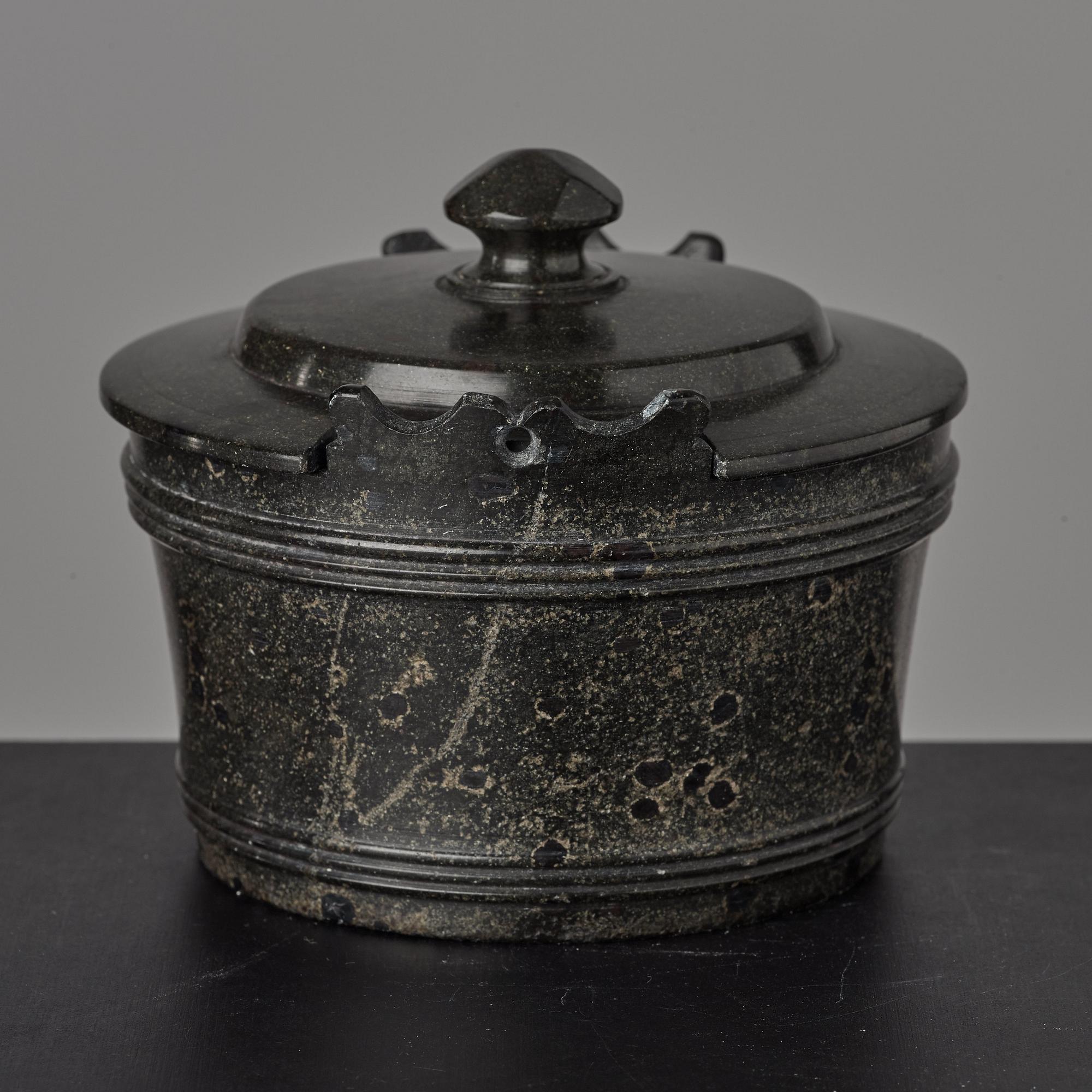 A serpentine stone butter box and cover circa 1800.
