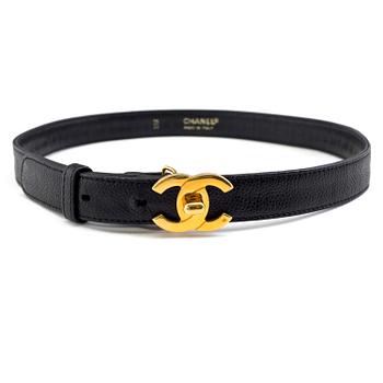 A black leather belt by Chanel.