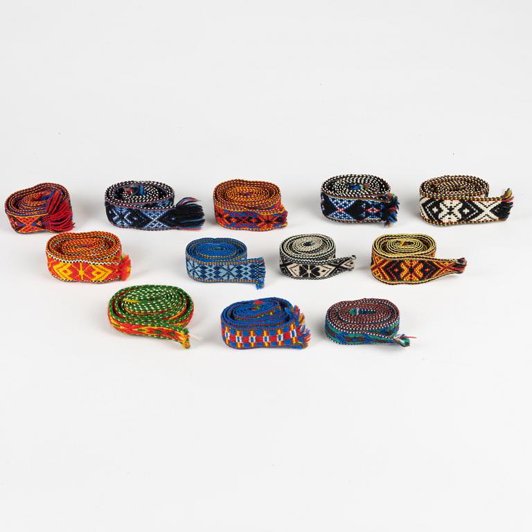 Twelve woven multicoloured bands, 20th Century.