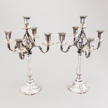 A pair of silver candelabra, presumably German, with Finnish control marks by Alexander Tillander, Helsinki.