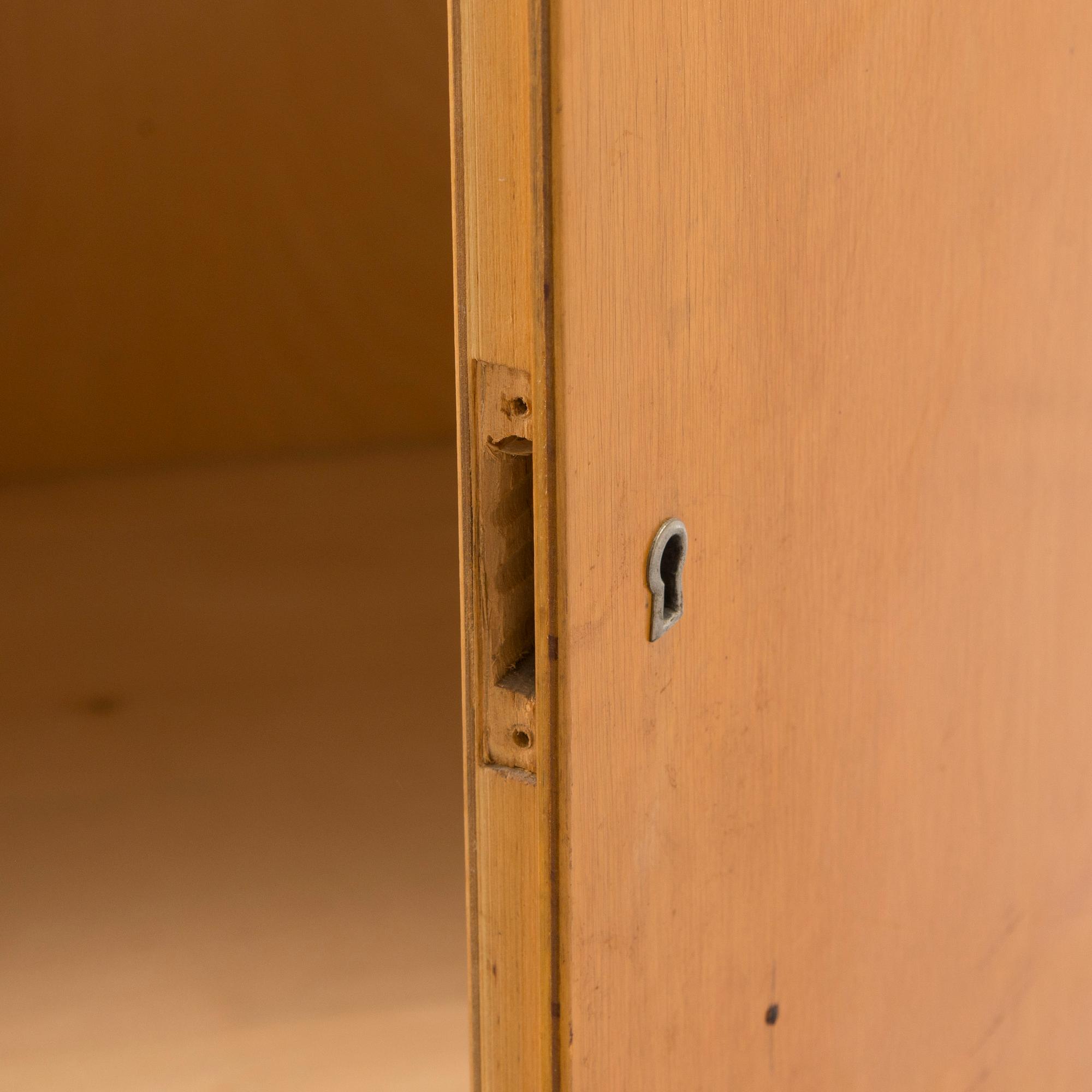 Alvar Aalto, mid-20th century '810' cabinet and a 
'69'chair Oy Huonekalu- ja Rakennustyötehdas Ab.