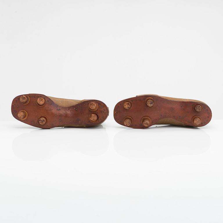 A pair of Olympic football shoes, labelled Karhu. Finland, 1940s.