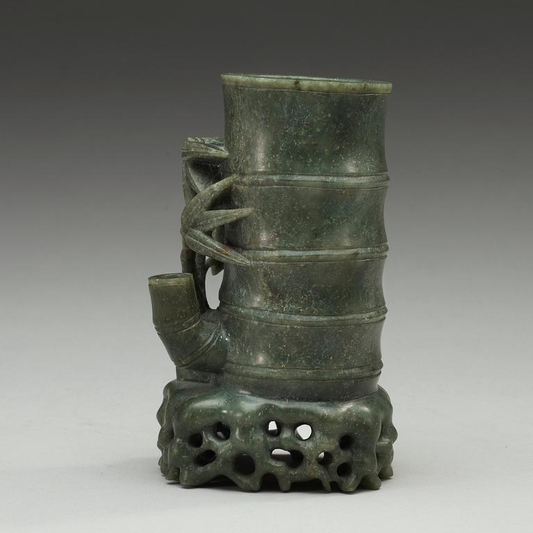 A green stone brush pot, China, 20th Century.