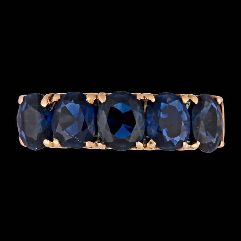 A five stonen blue sapphire ring.