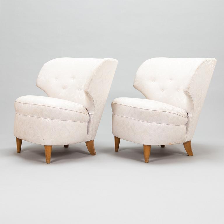 A pair of 1950's armchairs.