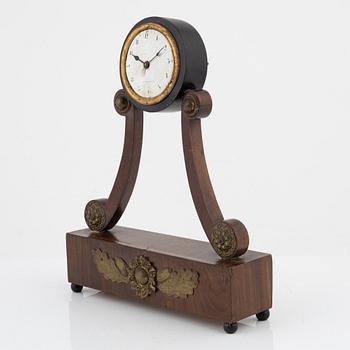 An Empire mantle clock from the 19th century.