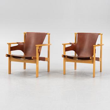 Carl-Axel Acking, a pair of oak and brown natural leather 'Trienna' chair, Nordiska Kompaniet, Sweden.