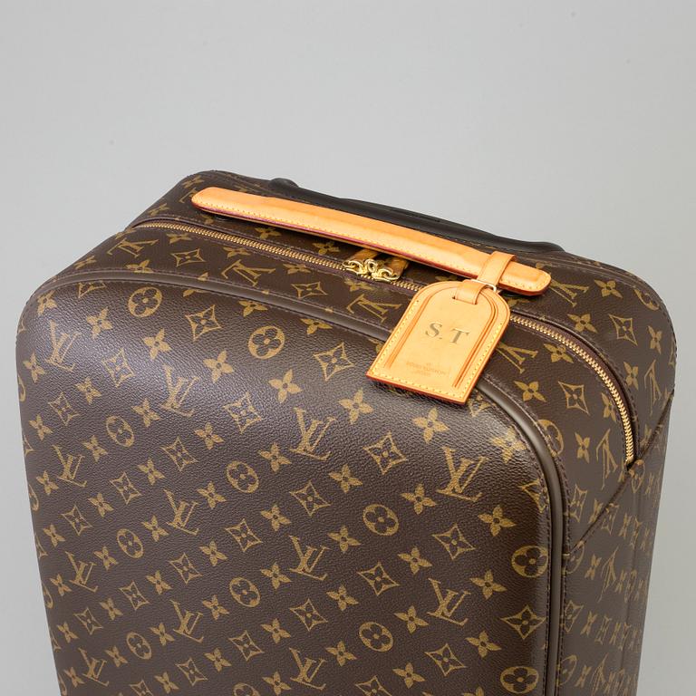 A Monogram Canvas "Zephyr" Suitcase by Louis Vuitton.