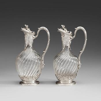 787. A pair of French late 19th century silver and glass wine-flagons.