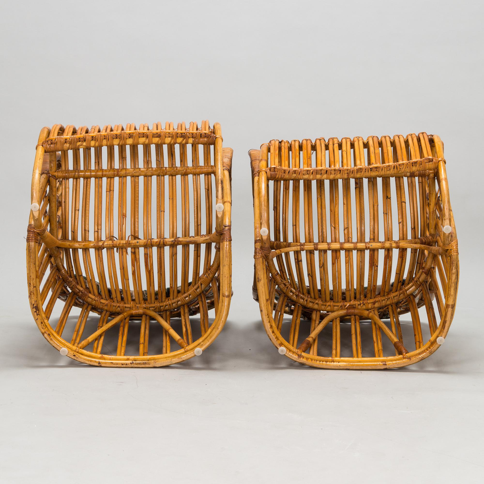 A pair of mid-20th-century rattan armchairs.