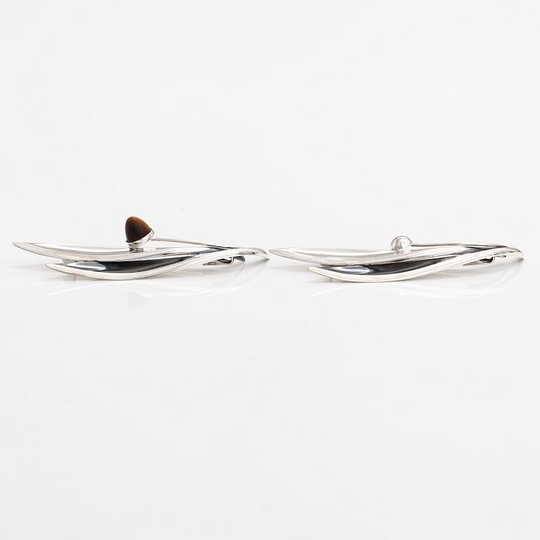 Elis Kauppi, Two silver brooches, one with a tiger's eye. Kupittaan kulta, Turku 1959 and 1962.