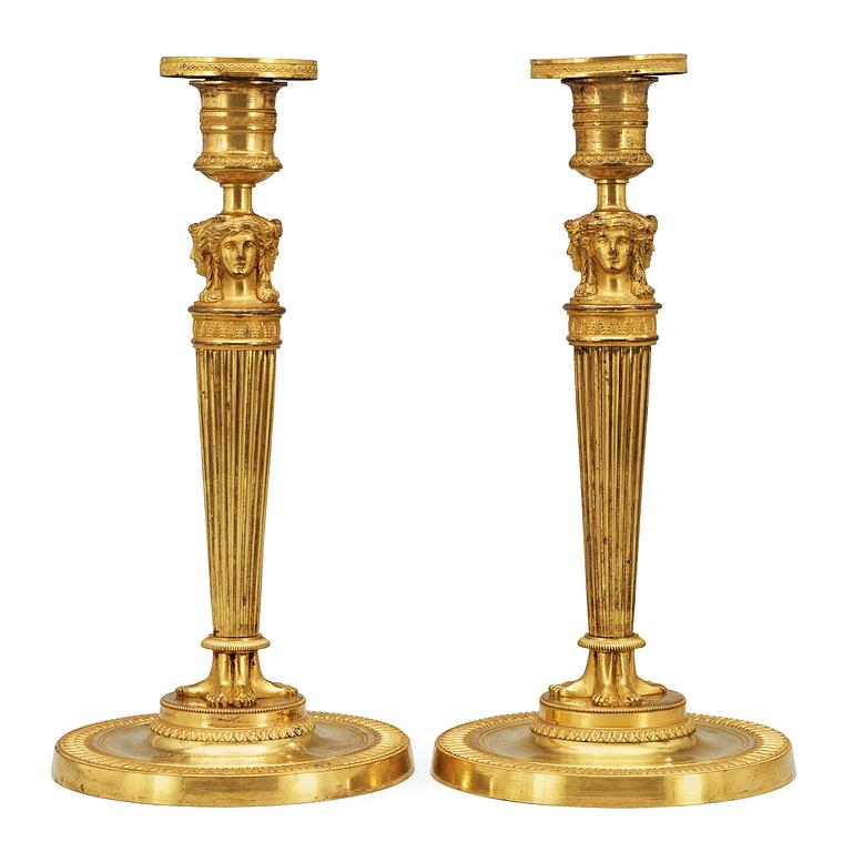 A pair of French Empire early 19th Century candlesticks.