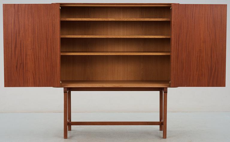 A Josef Frank mahogany cabinet, doors and sides covered in Frank's floral chintz fabric 'Fatima', Svenskt Tenn ca 1937.