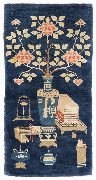 A Boutou rug, China, c. 145 x 75 cm.