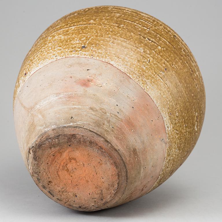 A olive green glazed jar, South East Asia, 18th Century or older.