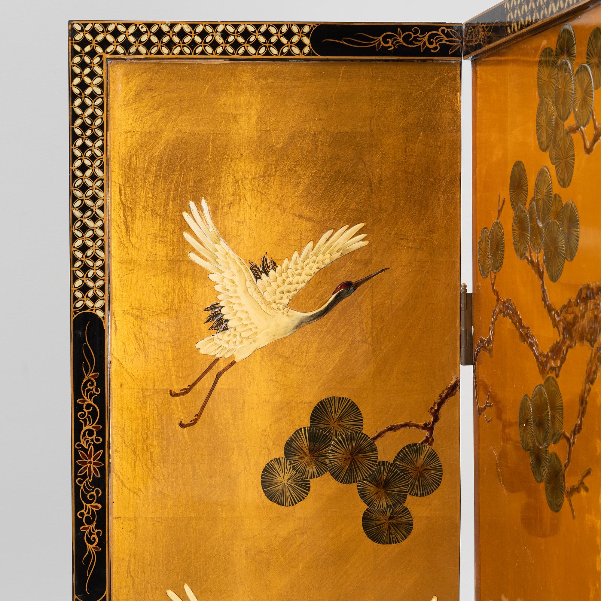 A Chinese lacquer folding screen, 20th century.