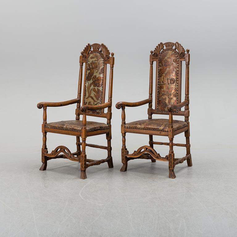 A first half of the 18th century pair of baroque oak armchairs.