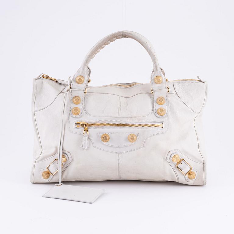 Balenciaga, a white leather 'City' bag.